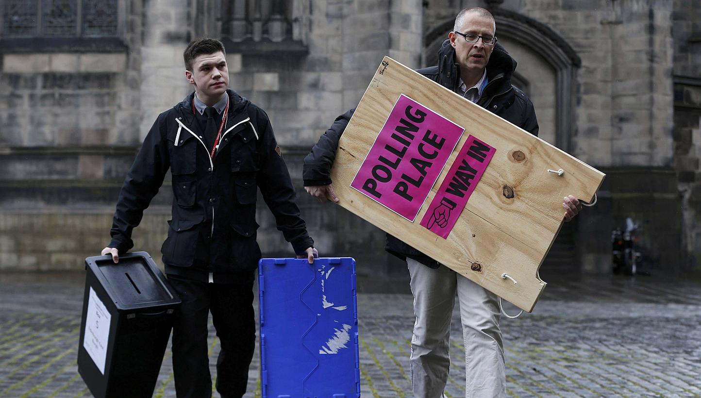 Ballot boxes are carried across West Parliament Square in Edinburgh Scotland, Britain&nbsp;on May 6, 2015. Britons voted on Thursday in a knife-edge general election that could put their country’s membership of the European Union in question and ra