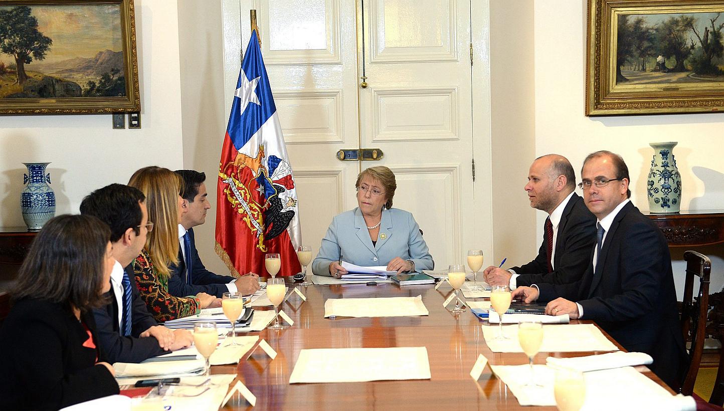 Chilean President Michelle Bachelet (centre) meeting with members of the Committee of Politics at La Moneda Palace in Santiago de Chile, on May 6, 2015. Ms Bachelet announced a surprise Cabinet reshuffle on Wednesday, in a second-term scramble to sil