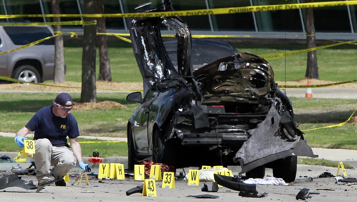 Members of the FBI Evidence Response Team investigate the crime scene outside of the Curtis Culwell Centre after a shooting occurred the day before, on May 4, 2015 in Garland, Texas. -- PHOTO: AFP