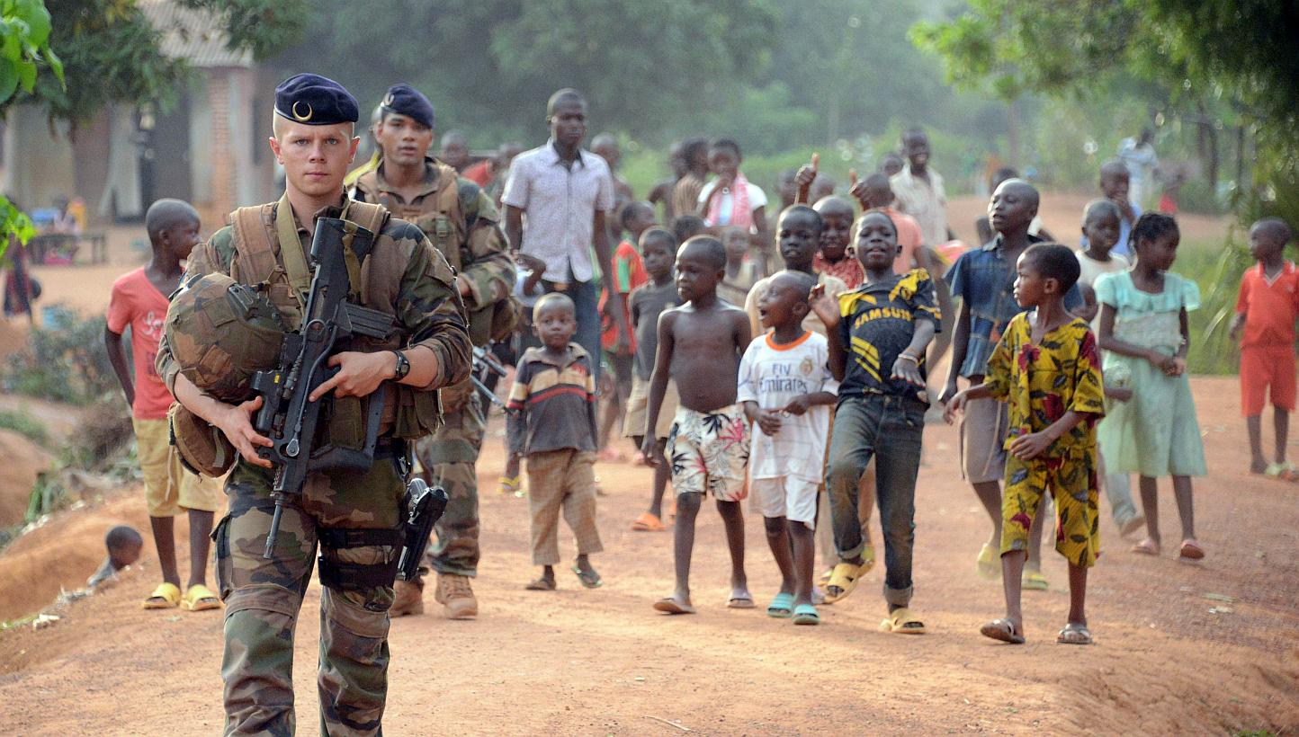 French soldiers patrol a street in Bangui, part of 'Operation Sangaris', on May 2, 2015. Faced with mounting pressure to shed light on accusations that French soldiers sexually abused children in the Central African Republic, the United Nations said 