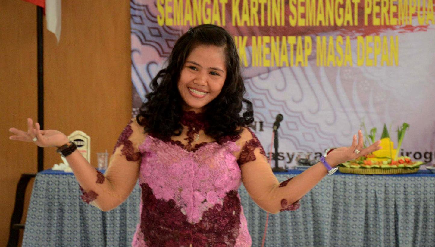 In this photo taken on April 29, 2015, migrant recruiter Cristina Sergio (second left) is escorted by local government officials after a press conference in Manila, after Sergio, 47, who is suspected of asking Filipina drug convict Mary Jane Veloso t