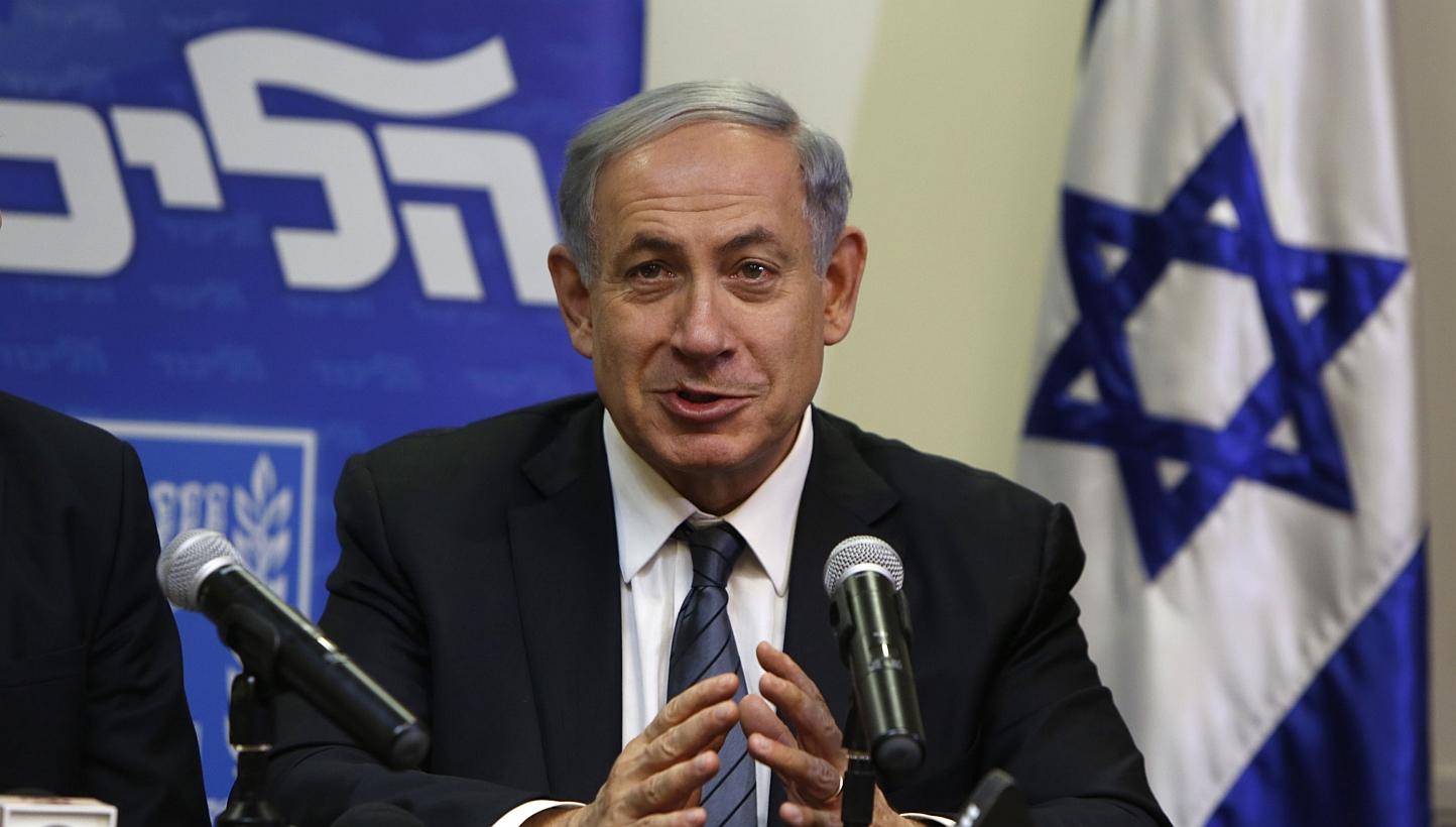 Israeli Prime Minister Benjamin Netanyahu speaks during a press conference at the Knesset in Jerusalem late on Wednesday to announce the formation of a coalition government and reaching an agreement with the religious nationalist Jewish Home party. -