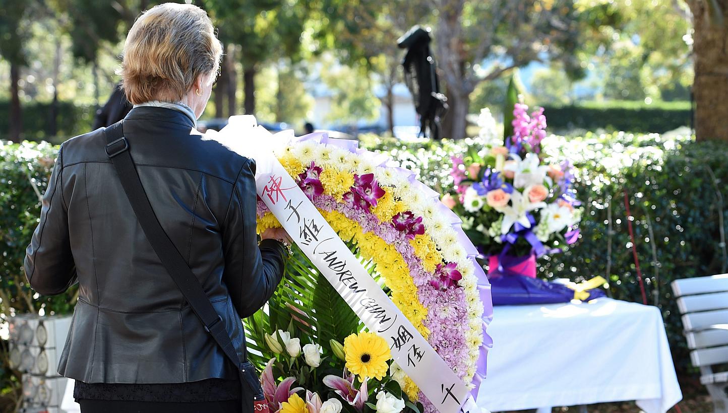 A mourner placing a floral wreath at the funeral service of Andrew Chan in Sydney, Australia, on May 8, 2015. -- PHOTO: EPA
