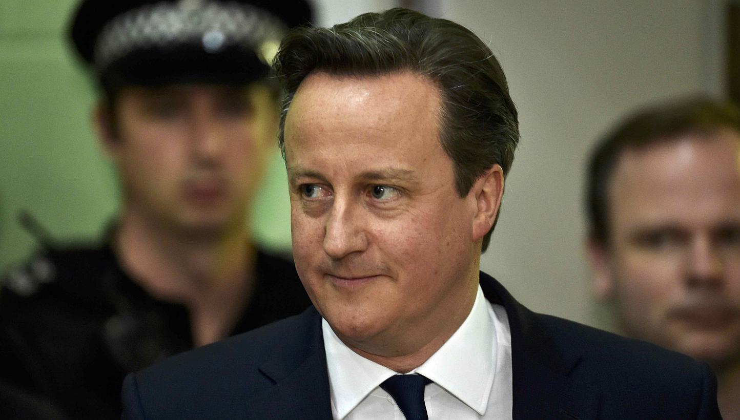 Britain's Prime Minister David Cameron arriving for the result of his seat at the counting centre for his local constituency as ballots are tallied in Britain's general election, in Witney, on May 8, 2015. -- PHOTO: REUTERS&nbsp;