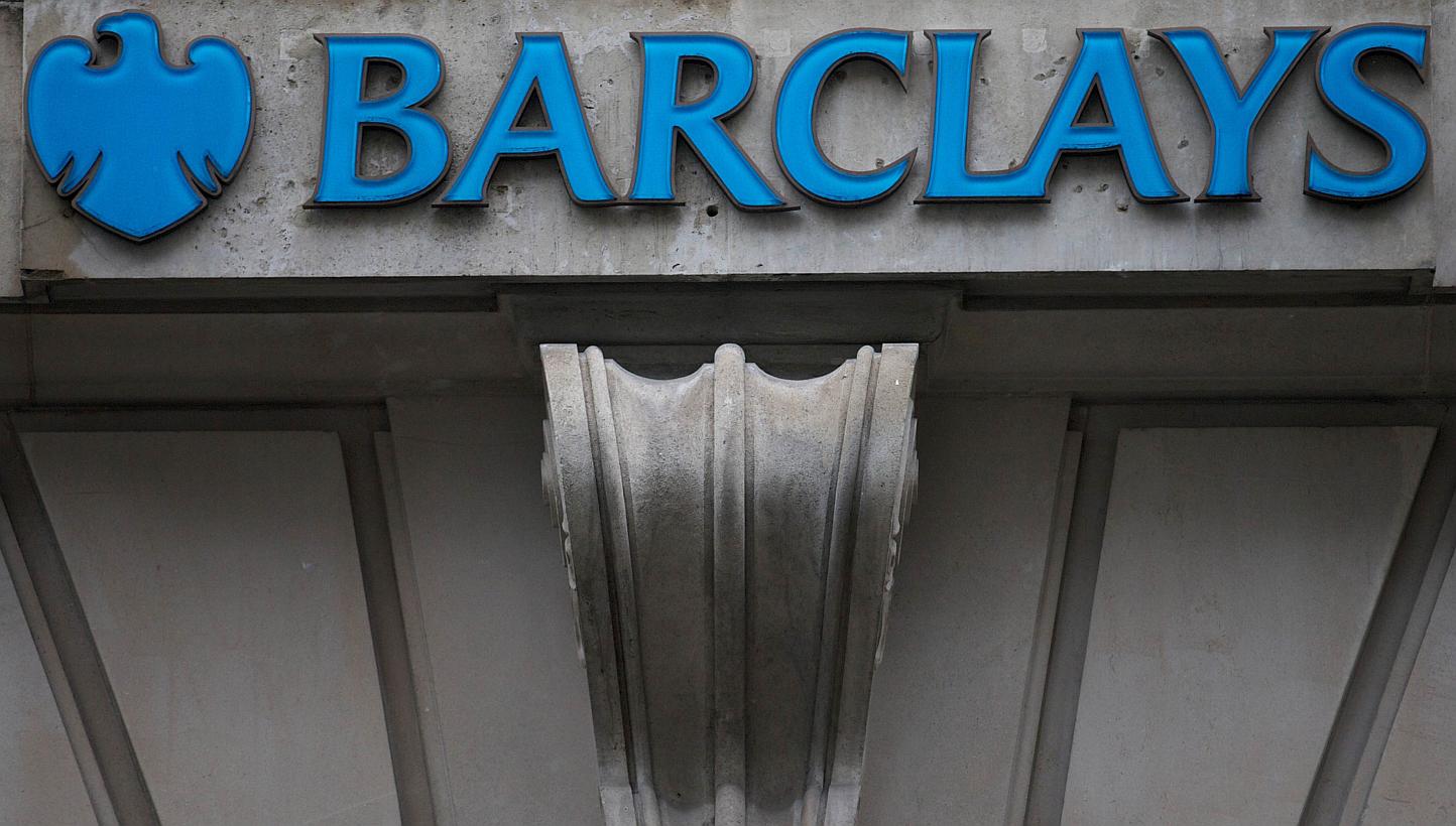 A Barclays branch in central London in 2013. Barclays is among five leading banks that are close to agreements with regulators to pay billions of dollars over charges they rigged the foreign exchange market. -- PHOTO: AFP