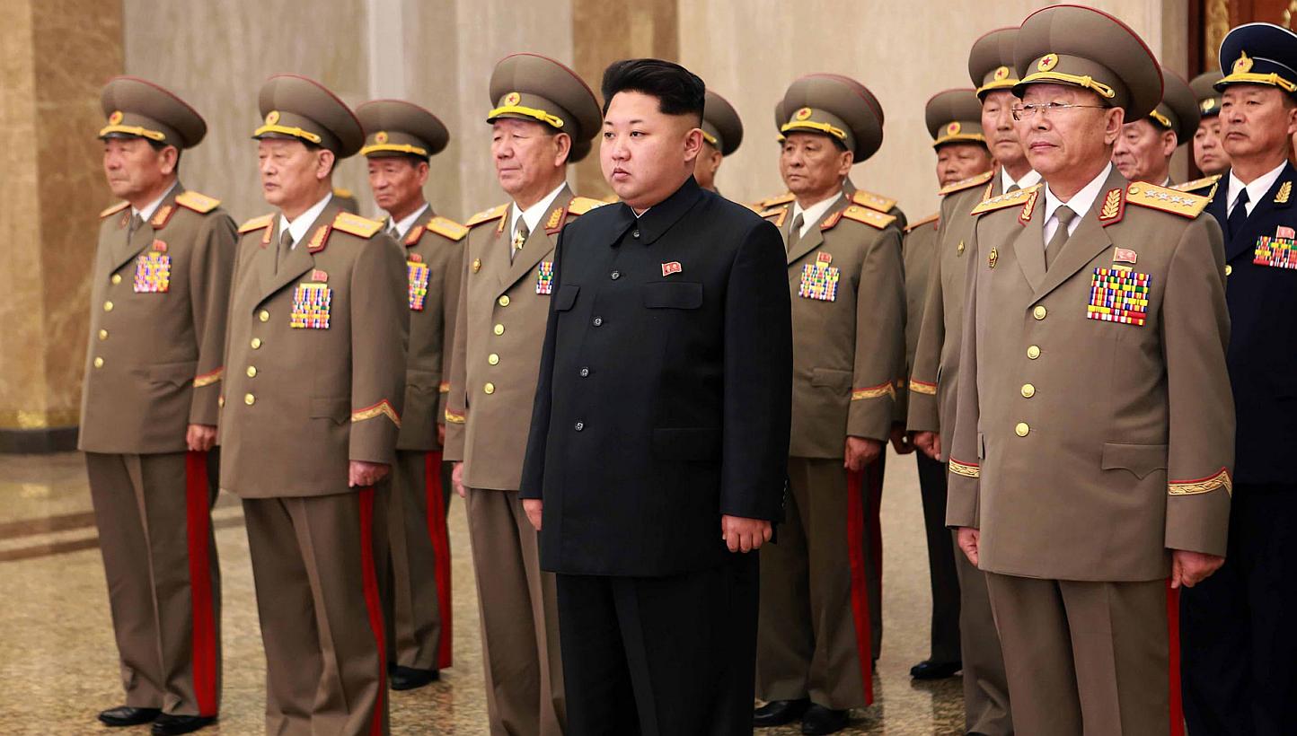 North Korean leader Kim Jong Un (centre) visiting the Kumsusan Palace of the Sun in Pyongyang to celebrate the 103rd birth anniversary of late president Kim Il Sung, his grandfather on on April 15, 2015. North Korea's military warned on Friday of "un