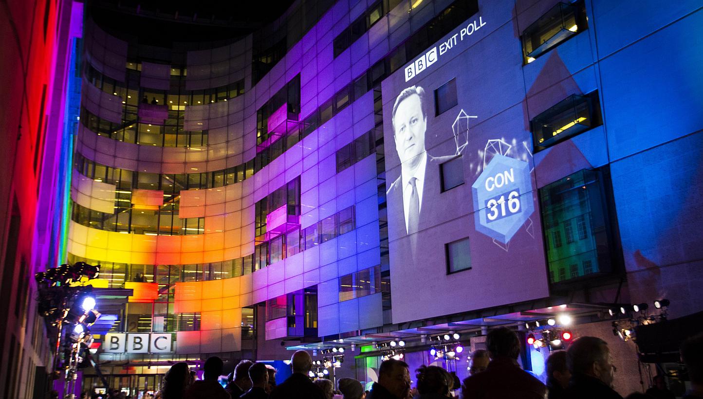 An exit poll predicting that the Conservative Party will be the largest part with 316 seats is projected onto BBC Broadcasting House, Portland Place in London as voting finishes in Britain’s general election on May 7, 2015. -- PHOTO: AFP