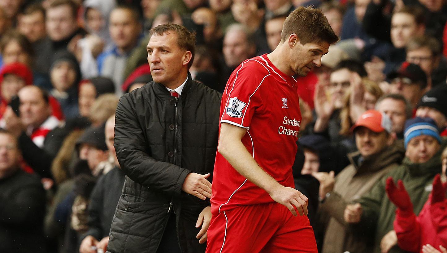 Liverpool manager Brendan Rodgers (left) and player Steven Gerrard. Liverpool must reluctantly subject themselves to the after-glow of Chelsea's Premier League title triumph on Sunday as they seek to keep their slim hopes of Champions League qualific