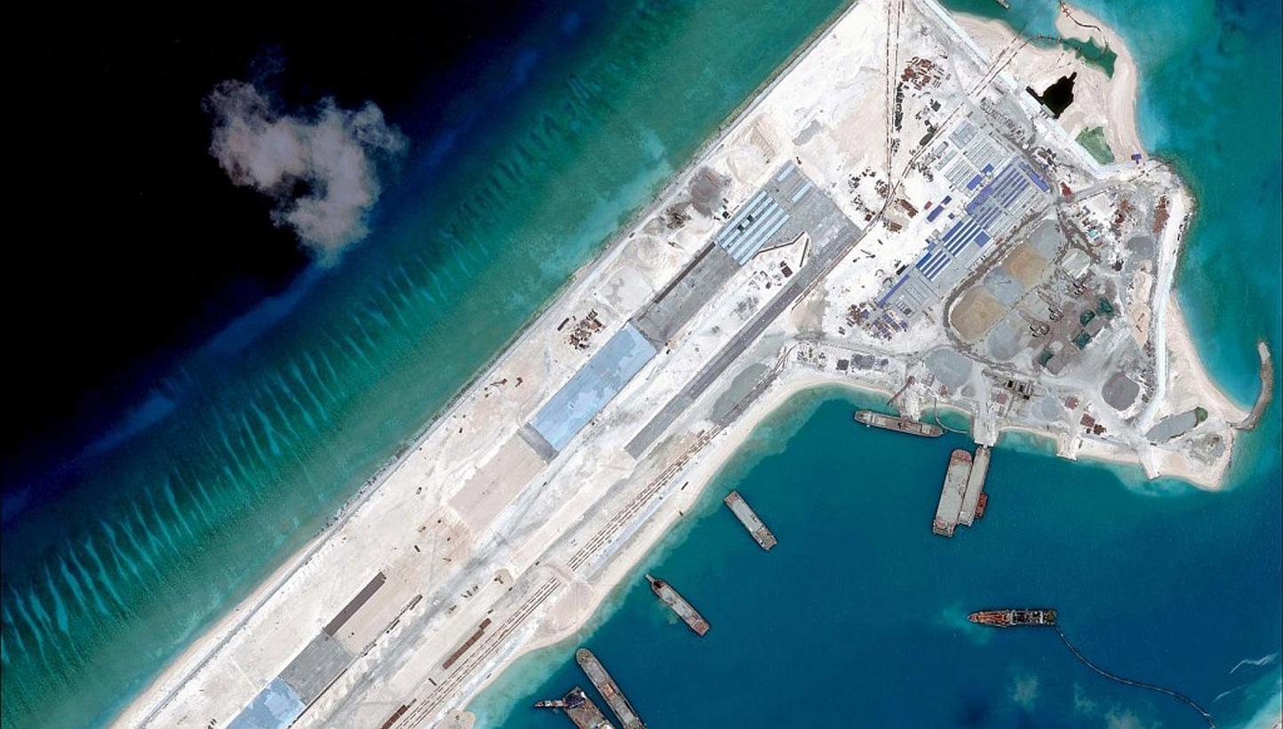 A satellite image from April 2015 showing China's construction of a runway on Fiery Cross Reef in the Spratly Island chain, estimated at 3.1km in total. -- PHOTO: REUTERS