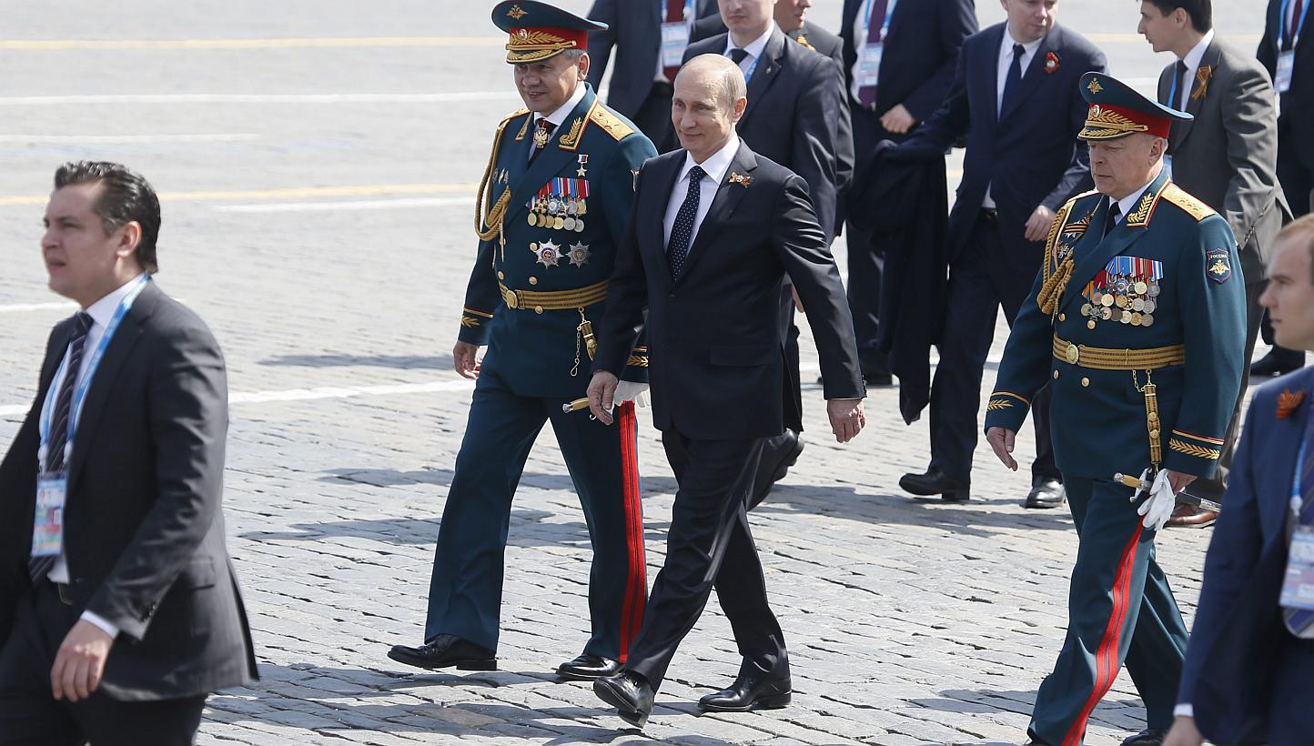 Russian President Vladimir Putin (third left) and Russian Defence Minister Sergei Shoigu (second left) walk after the Victory Day military parade in the Red square in Moscow, Russia, May 9, 2015. -- PHOTO: EPA &nbsp;