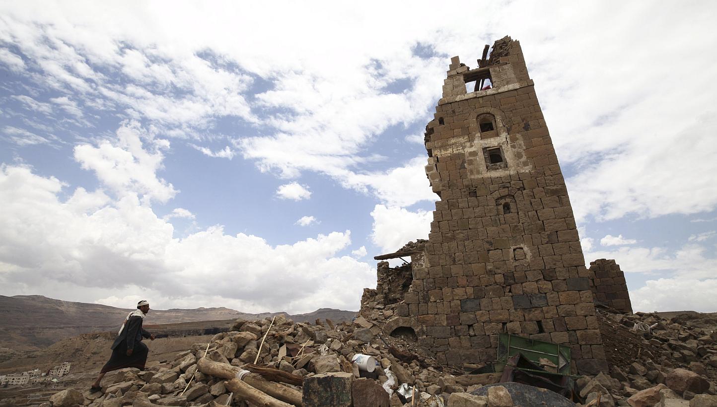 A man walks to a house that was damaged during an airstrike carried out by the Saudi-led coalition in Faj Attan village, Sanaa, Yemen May 7, 2015. -- PHOTO: REUTERS&nbsp;