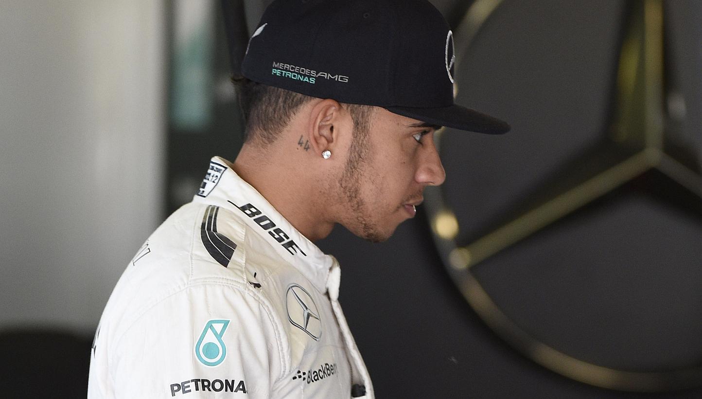 Britain's Lewis Hamilton stands in the pits during the second practice session at the Circuit de Catalunya on May 8, 2015, ahead of the Spanish Formula One Grand Prix. -- PHOTO: AFP