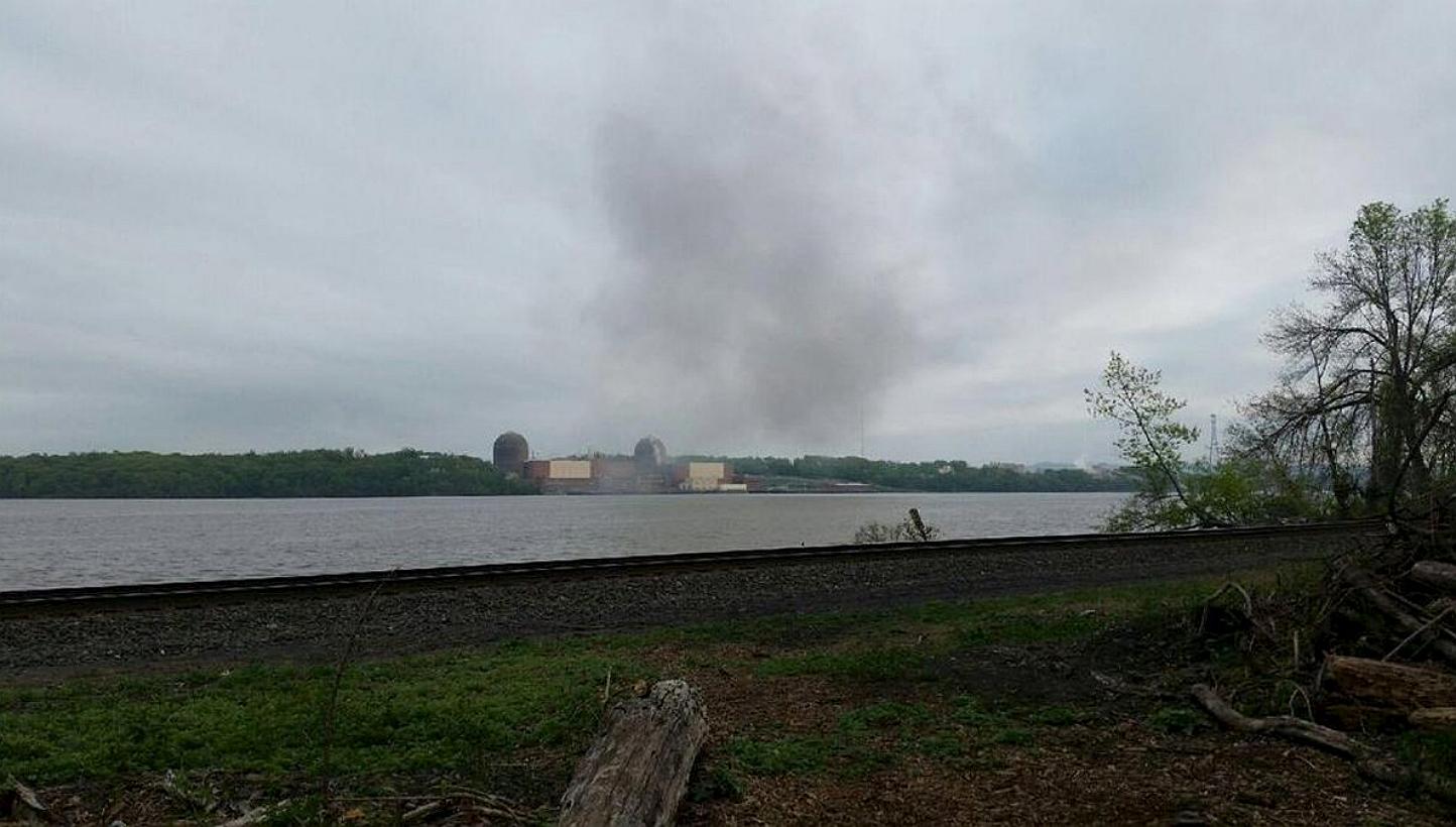 Smoke is seen over the Indian Point nuclear power plant in New York, in this handout photo provided by Gustavus Gricius taken on May 9, 2015. A nuclear power reactor to the north of New York City was shut down on Saturday after a transformer fir