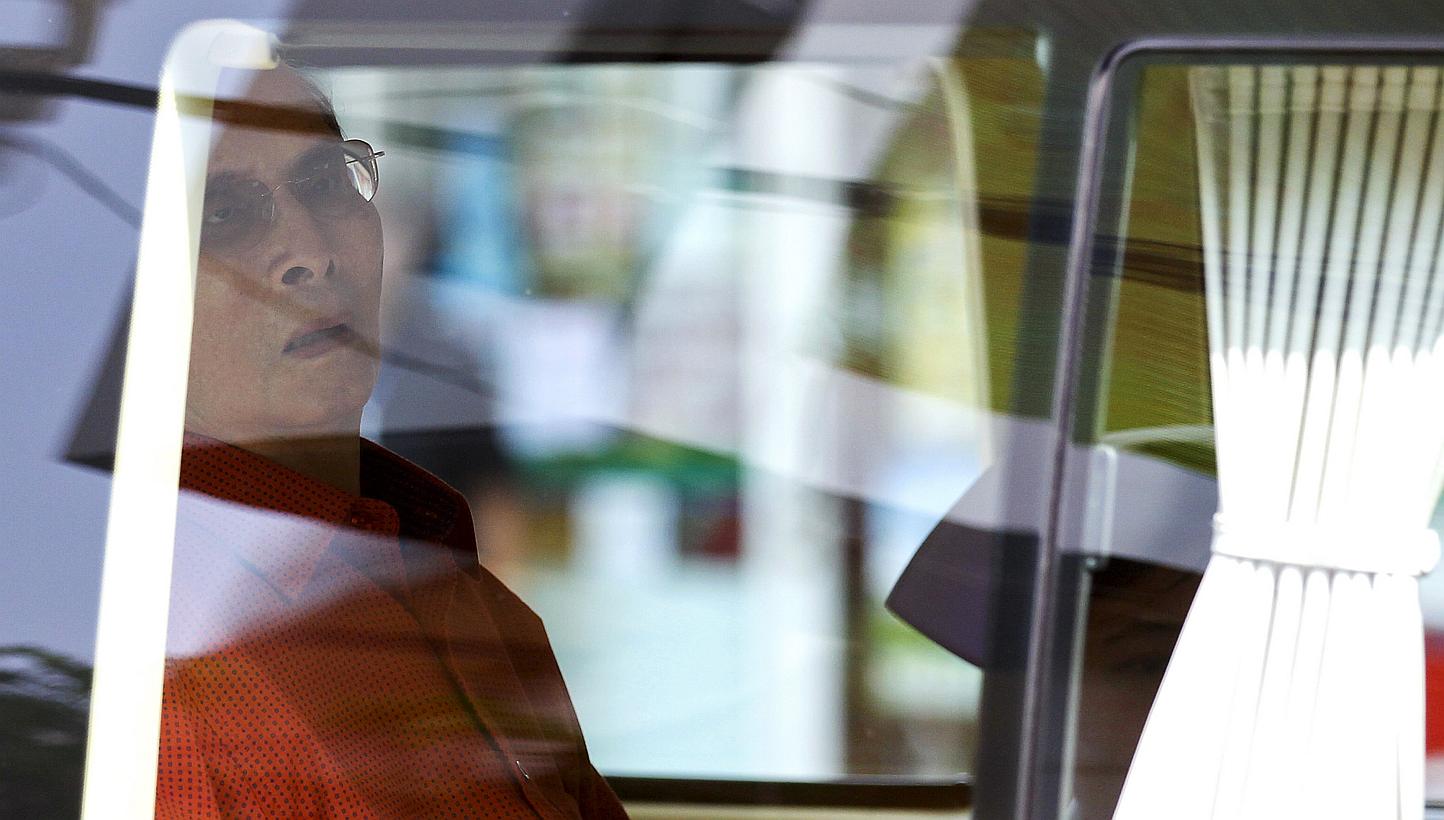 Thailand's King Bhumibol Adulyadej sits in a vehicle as he leaves Siriraj Hospital in Bangkok, Thailand on&nbsp;May 10, 2015, after seven months spent convalescing following surgery last year, to the joy of many in Thailand where the king is widely r