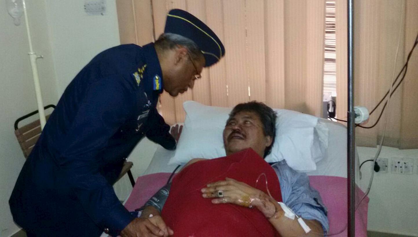 Air Chief Marshal Sohail Aman visits Malaysian Ambassador Hasrul Sani Mujtabar at the CMH hospital in Gilgit, Pakistan, in a handout picture received on May 8, 2015. Three ambassadors to Pakistan who survived a helicopter crash that killed seven peop