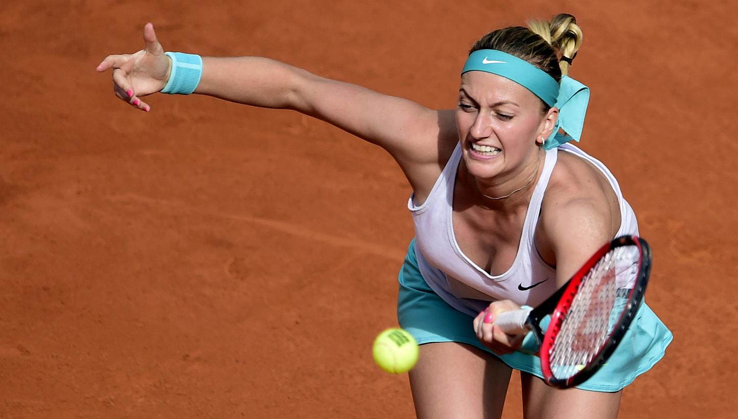 Czech tennis player Petra Kvitova returns a ball to Russian tennis player Svetlana Kuznetsova during the women\s final of the Madrid Open on May 9, 2015. -- PHOTO: AFP