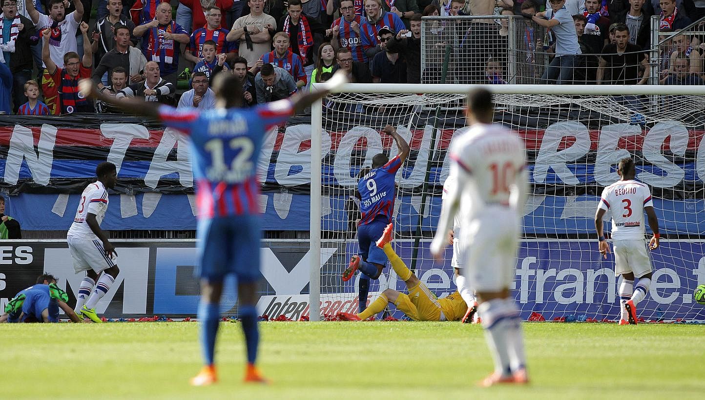 Caen's French forward Nicolas Benezet (unseen) scores the opening goal during the Ligue 1 match between Caen and Lyon on May 9, 2015. -- PHOTO: AFP&nbsp;