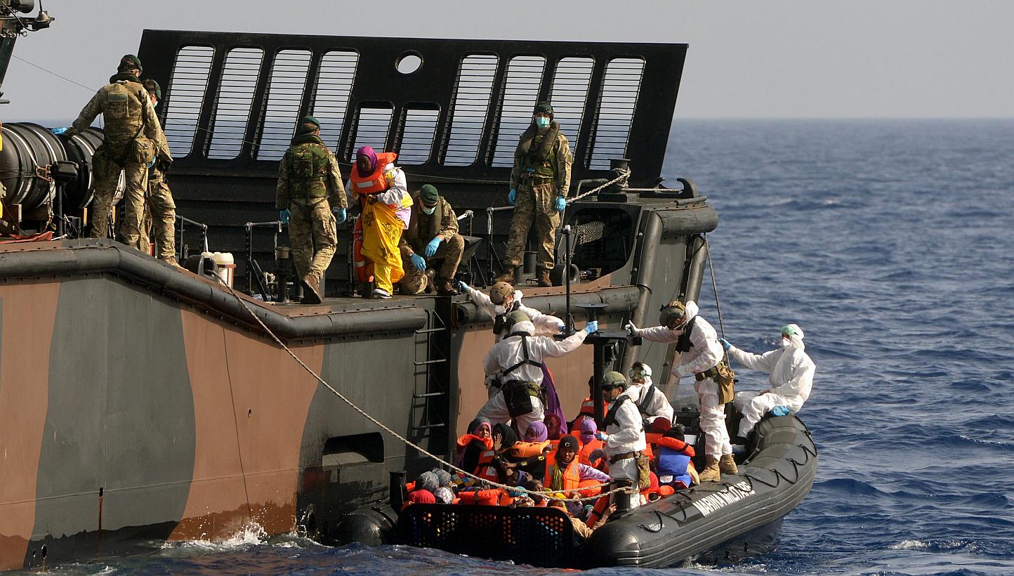 British Royal Navy personnel from HMS Bulwark helping rescued individuals onto a Royal Navy Landing Craft, in the Mediterranean Sea. Europe's first priority in confronting the Mediterranean migrant crisis is to save lives, EU foreign policy chief Fed