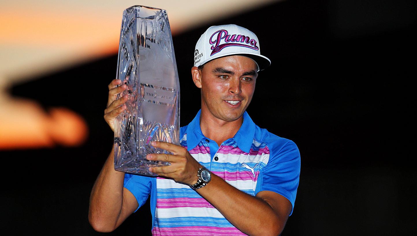 Rickie Fowler celebrates with the winner's trophy after the final round of The Players Championship at the TPC Sawgrass Stadium course on May 10, 2015 in Ponte Vedra Beach, Florida. -- PHOTO: AFP&nbsp;
