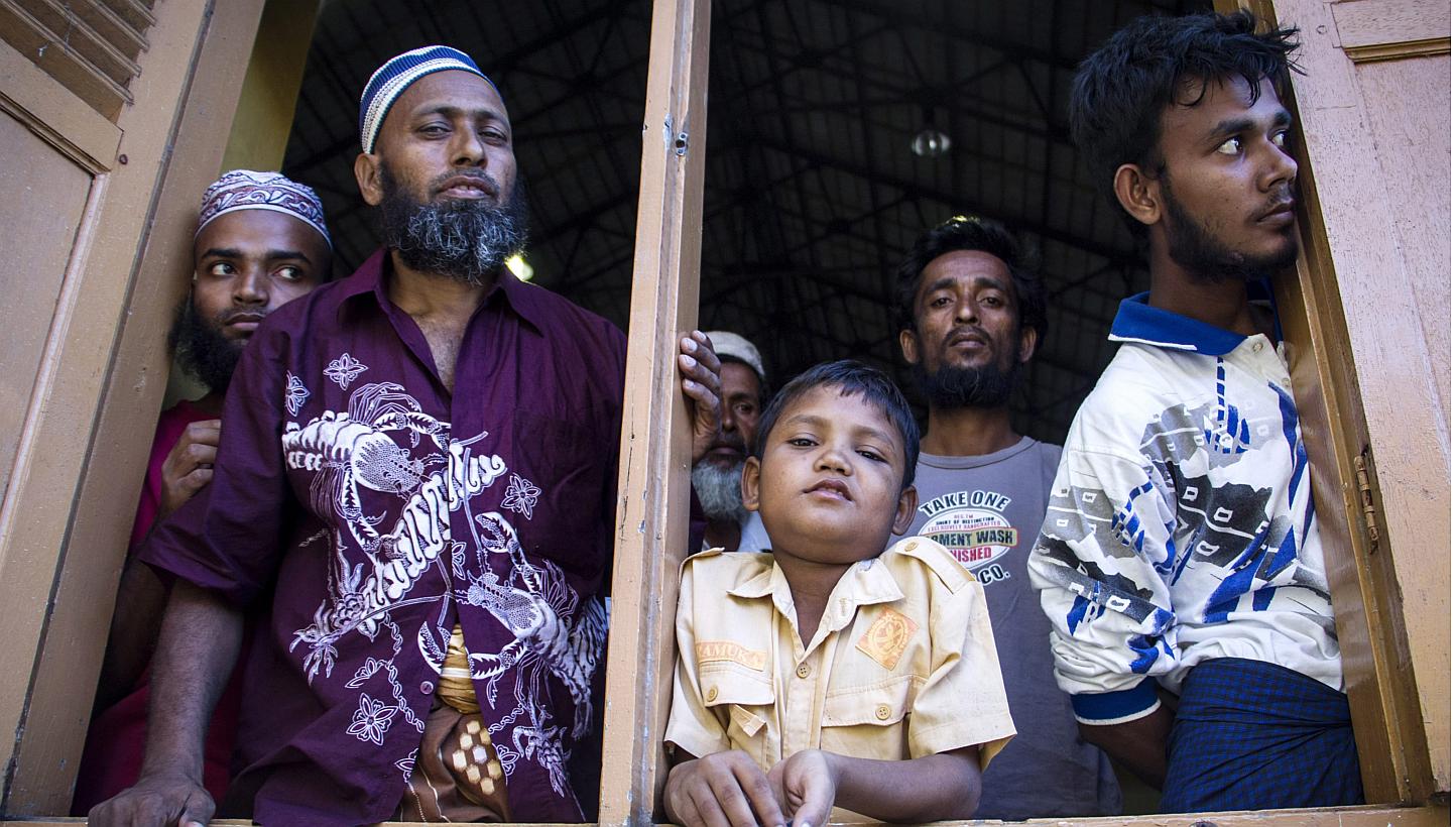 Migrants from Myanmar and Bangladesh at a police station in Kuah, Langkawi, in the Malaysian state of Kedah on May 11, 2015. -- PHOTO: EPA 