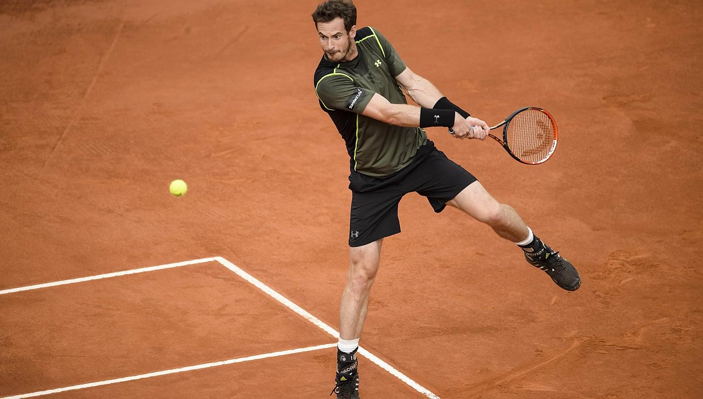 &nbsp;Andy Murray returns a ball to Spain's Rafael Nadal during the men final of Madrid Open tournament at the Caja Magica (Magic Box) sports complex in Madrid on Sunday. -- PHOTO:&nbsp;AFP