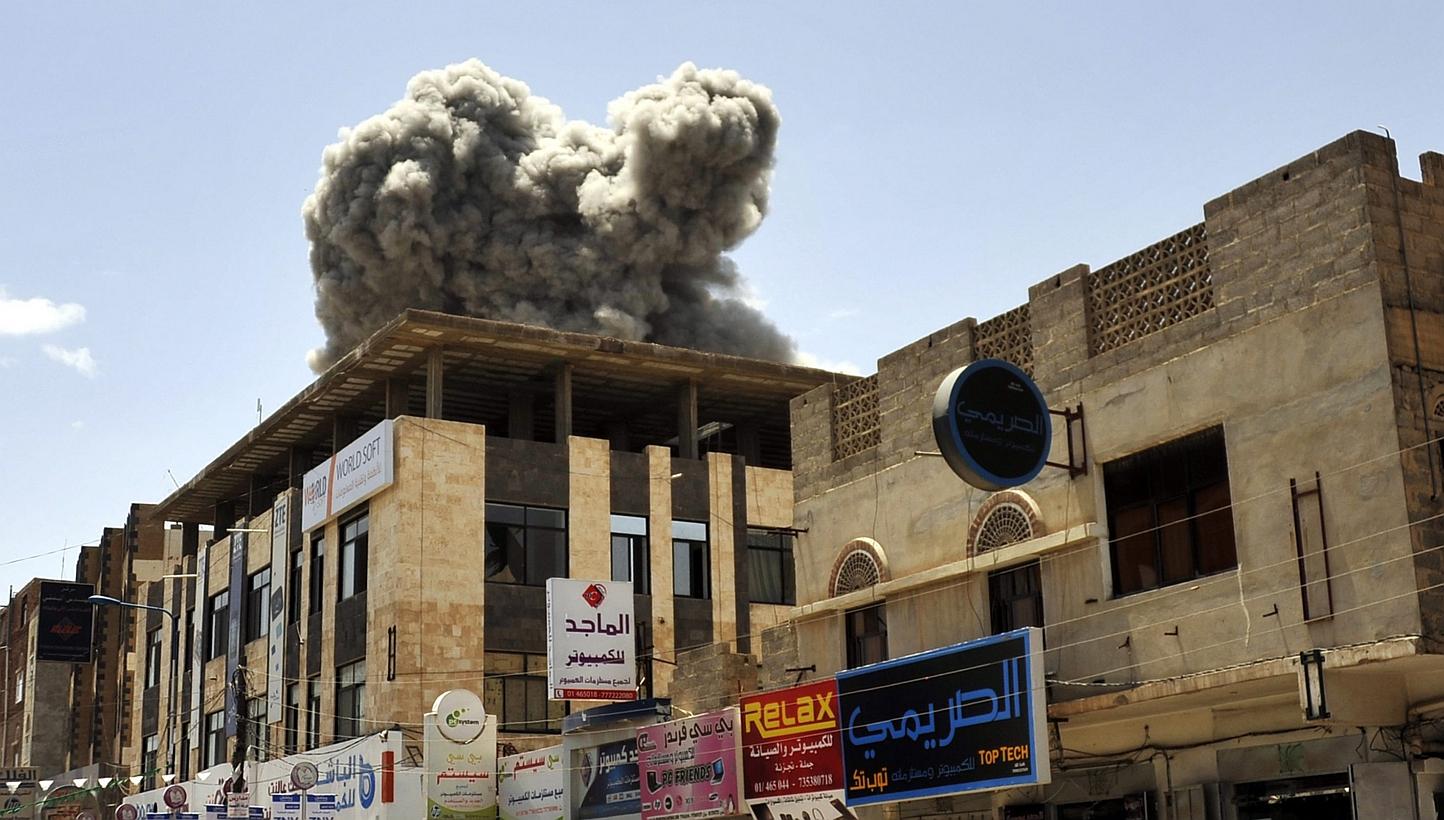 Smoke rises above the residence of former Yemeni President Ali Abdullah Saleh following an airstrike carried out by the Saudi-led alliance in Sana’a, Yemen on Sunday. -- PHOTO: EPA