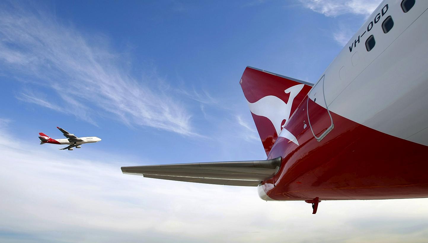 Shares of Qantas Airways surged to their highest level in more than six years in Sydney after Australia's biggest carrier said the global drop in oil prices would help cut its fuel bill this year. -- PHOTO: REUTERS