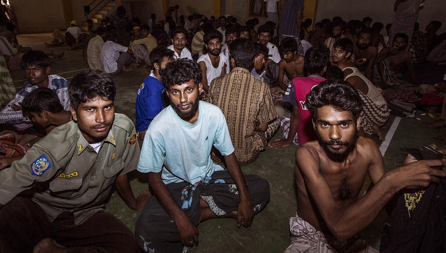 A group of rescued migrants mostly Rohingya migrants from Myanmar and Bangladesh are temporarily housed at a government sports auditorium in Lhoksukon, Aceh province, on May 11, 2015. -- PHOTO: AFP
