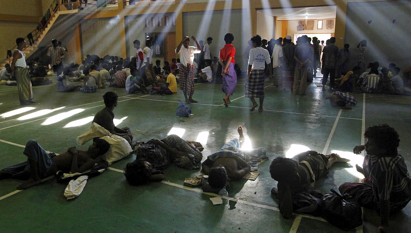 Migrants believed to be Rohingya are seen inside a shelter after being rescued from boats, in Lhoksukon, Indonesia's Aceh Province, on May 11, 2015. -- PHOTO: REUTERS