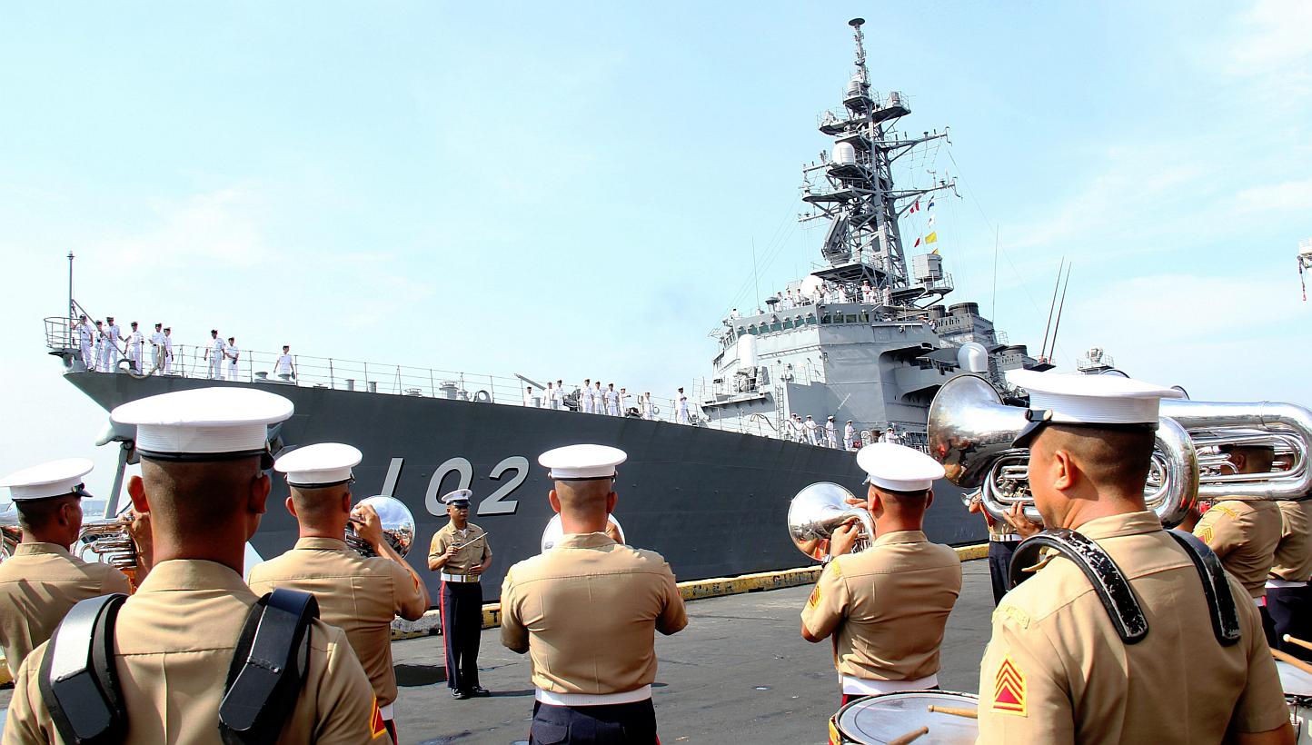 A handout picture released by the Philippine Navy Public Affairs Office shows the arrival of the Japanese navy (back) at Manila South harbor, Philippines on May 9, 2015. -- PHOTO: EPA