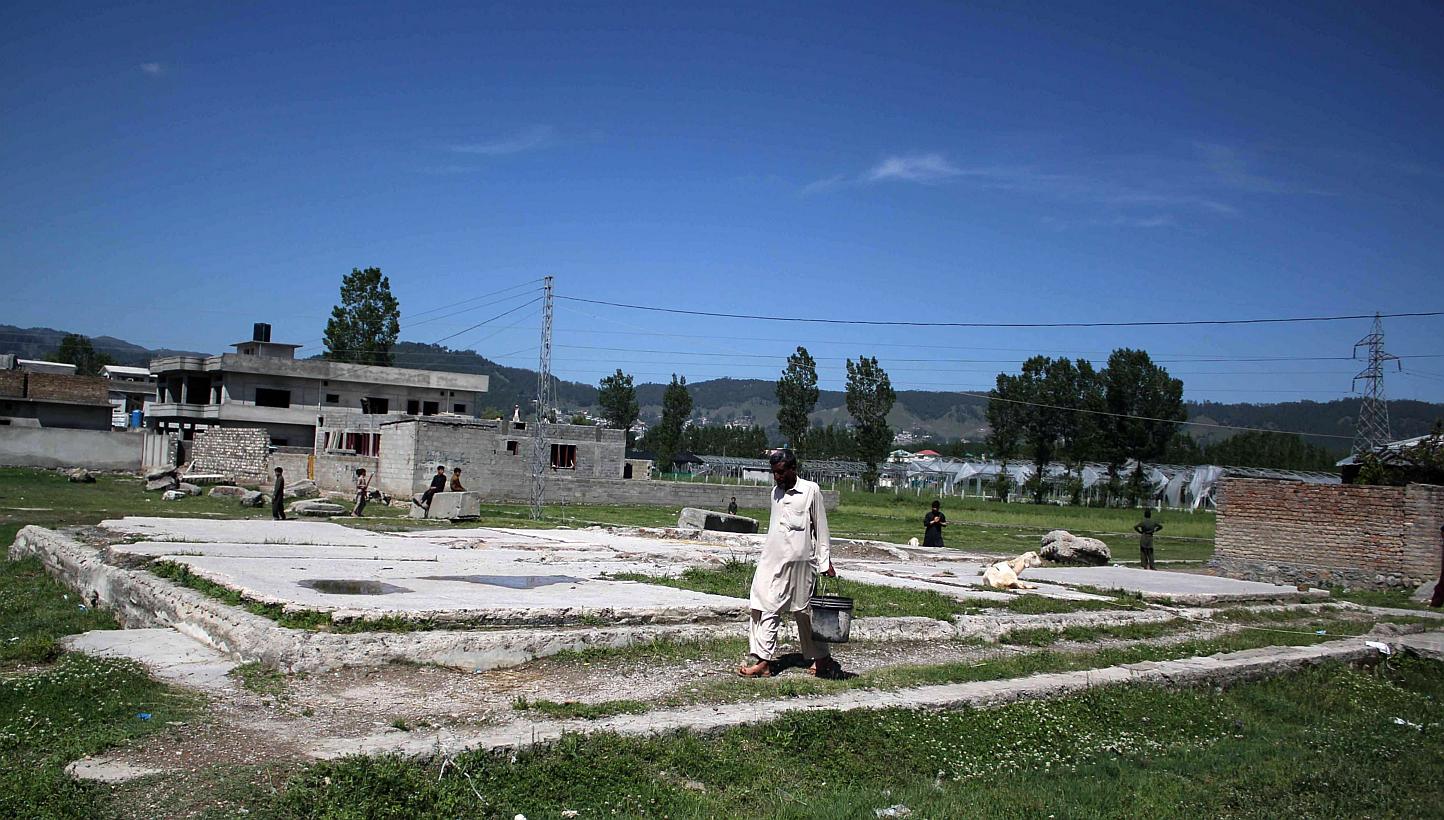 A man passing by the demolished site in Abbottabad, Pakistan, where Osama bin Laden was killed, on May 1, 2015, the fourth anniversary of his death. The White House has flatly rejected claims that Pakistan was told in advance about the 2011 special o