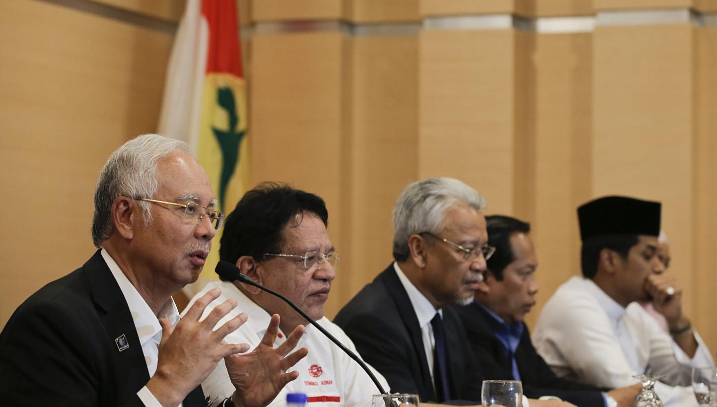 Malaysia's Prime Minister Najib Razak (left) speaks to members of the media during a news conference at Kuala Lumpur, Malaysia, on May 11, 2015. -- PHOTO: EPA