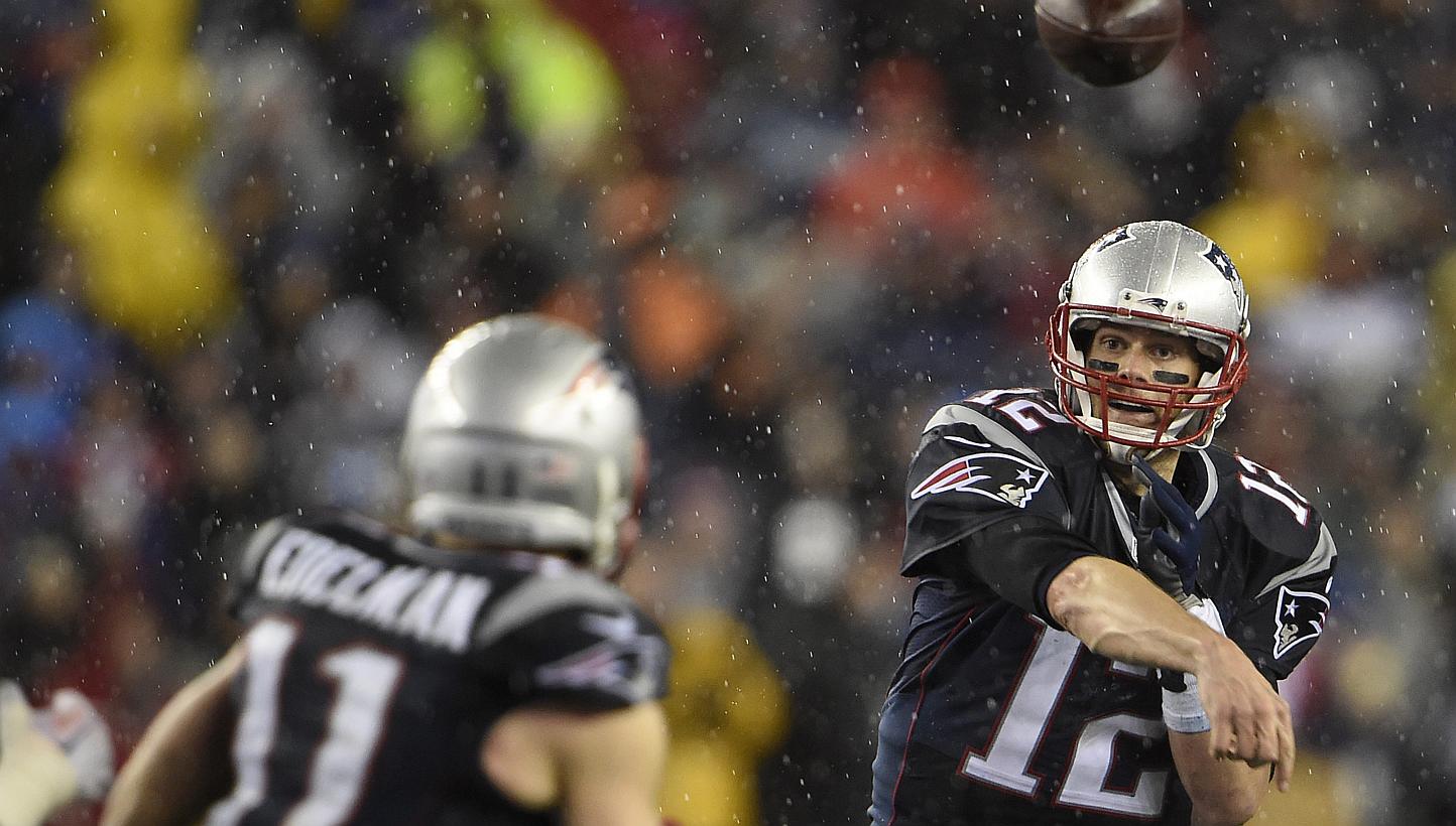 New England Patriots quarterback Tom Brady throwing a pass to Julian Edelman in the fourth quarter of their AFC Championship game at Gillette Stadium on Jan 18, 2015. -- PHOTO: EPA