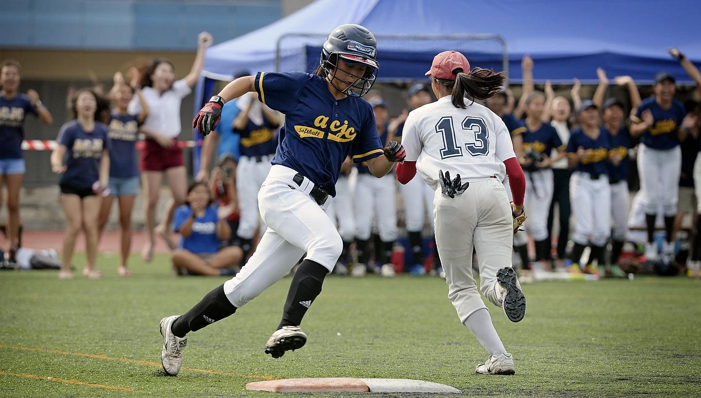 Anglo-Chinese Junior College's Anthia Yuan, 18, runs pass first base before scoring a home run during the match between River Valley High School on May 12, 2015. -- ST PHOTO: MARK CHEONG &nbsp;