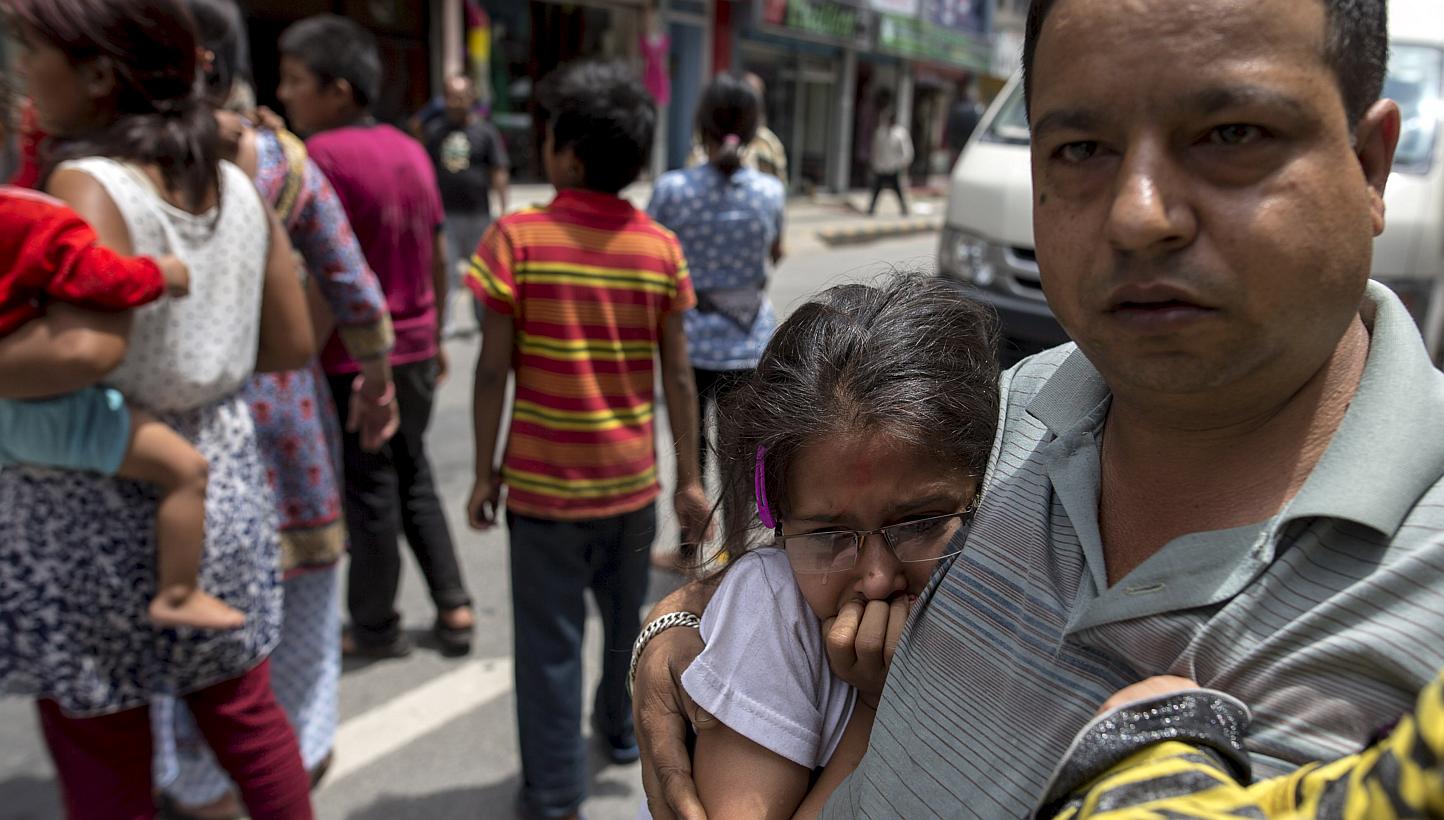 Local residents evacuate onto a street minutes after a fresh 7.3 earthquake struck, in central Kathmandu, Nepal, May 12, 2015. -- PHOTO: REUTERS