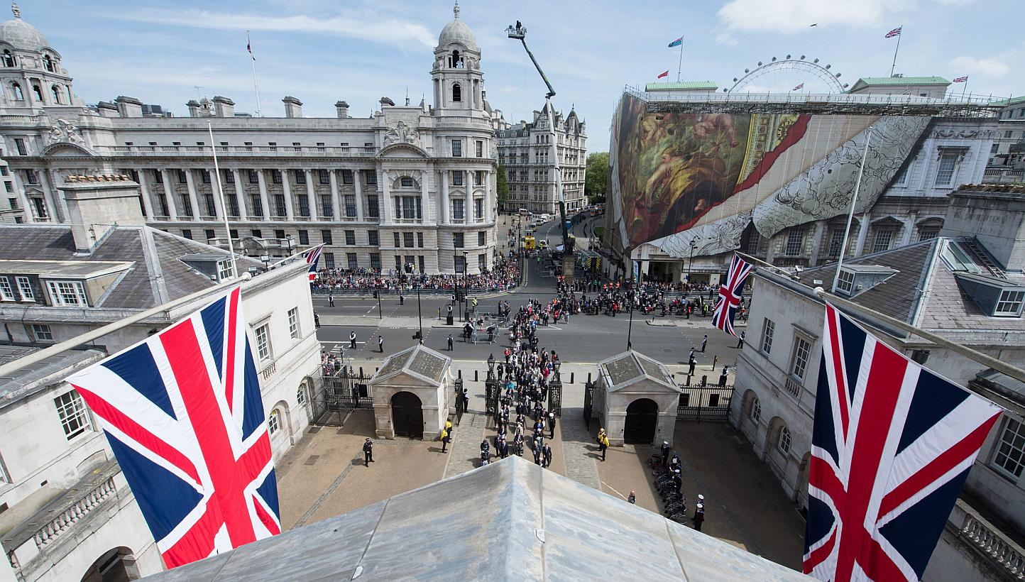 A handout photograph made available by the British Ministry of Defence showing a rooftop view from Horse Guards Parade of the VE Day Parade in central London, England, on May 10, 2015, after the service of Thanksgiving at Westminster Abbey. -- PHOTO: