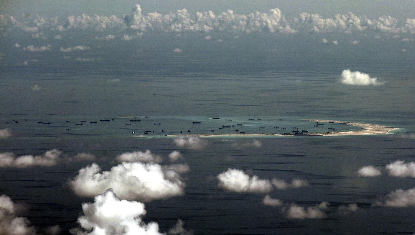 An aerial &nbsp;photo taken though a glass window inside a military plane of the alleged on-going reclamation by China into mischief reef in the Spratly group of islands in the South China Sea, west of Palawan, Philippines, on May 11, 2015. -- PHOTO: