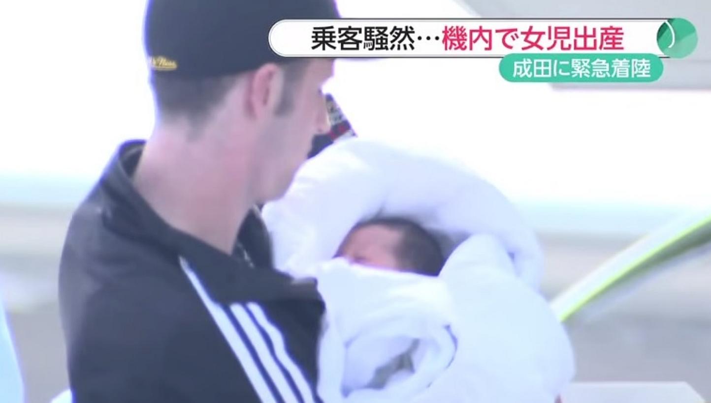 Canadian Wes Branch (pictured) holding his newborn daughter. He and his girlfriend Ada Guan were on an Air Canada flight from Calgary to Tokyo on Mother's Day when Ms Guan, who had no idea she was pregnant, gave birth. -- PHOTO: SCREENGRAB FROM YOUTU