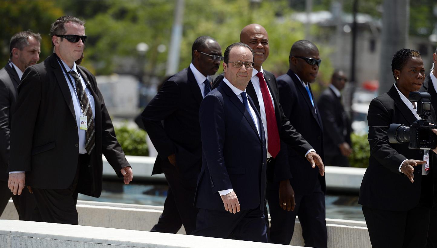 French president Francois Hollande (centre) and Haitian President Michel Martelly (third right) in Port-au-Prince, Haiti, May 12, 2015. &nbsp;President Francois Hollande arrived in Haiti on Tuesday to boost France's role in what was once its richest 