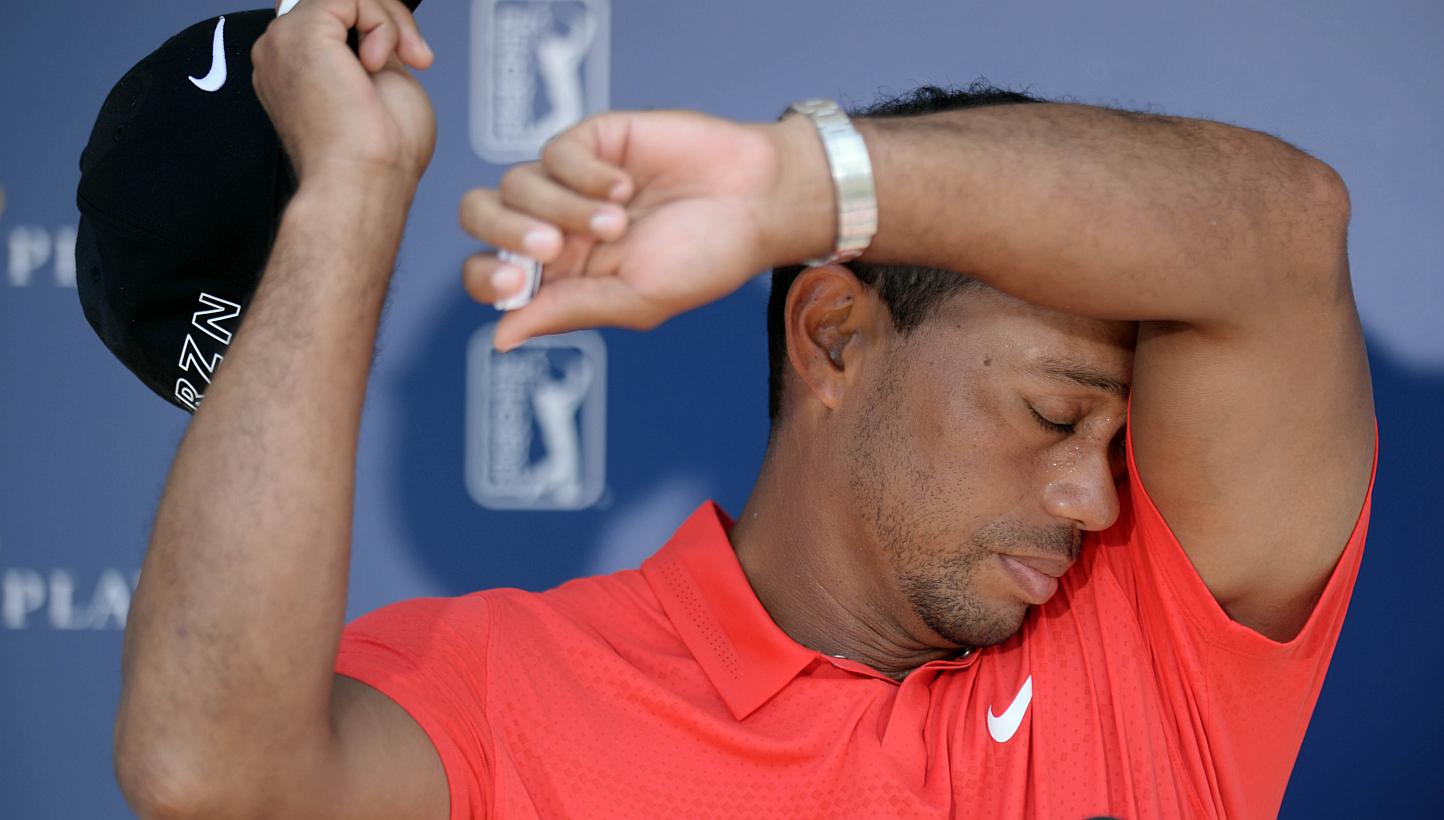 Tiger Woods wipes sweat from his head after completing the final round of The Players Championship at TPC Sawgrass - Stadium Course. He wrote a personal letter of support to a schoolboy who contemplated suicide because of a stutter, saying "I know wh