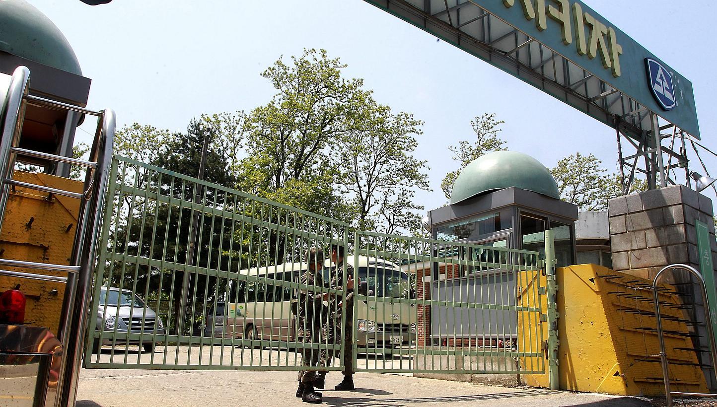 South Korean soldiers standing guard in front of the military camp where the incident took place in Naegok-dong, southern Seoul on May 13, 2015. -- PHOTO: EPA 