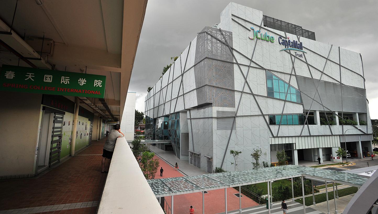 Owners of retail shops at housing blocks and shopping malls such as JCube (right) are jittery over potential competition from new commercial entities. -- PHOTO: ST FILE 
