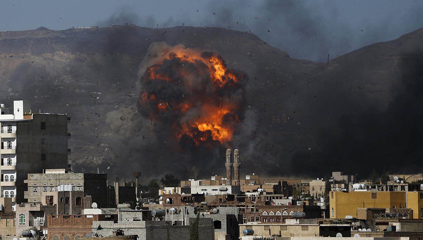 An air strike hits a military site controlled by the Houthi group in Yemen's capital Sanaa May 12, 2015. A ceasefire after weeks of Saudi-led coalition bombing in Yemen began on Tuesday night, but the coalition warned Iran-backed rebels that it would