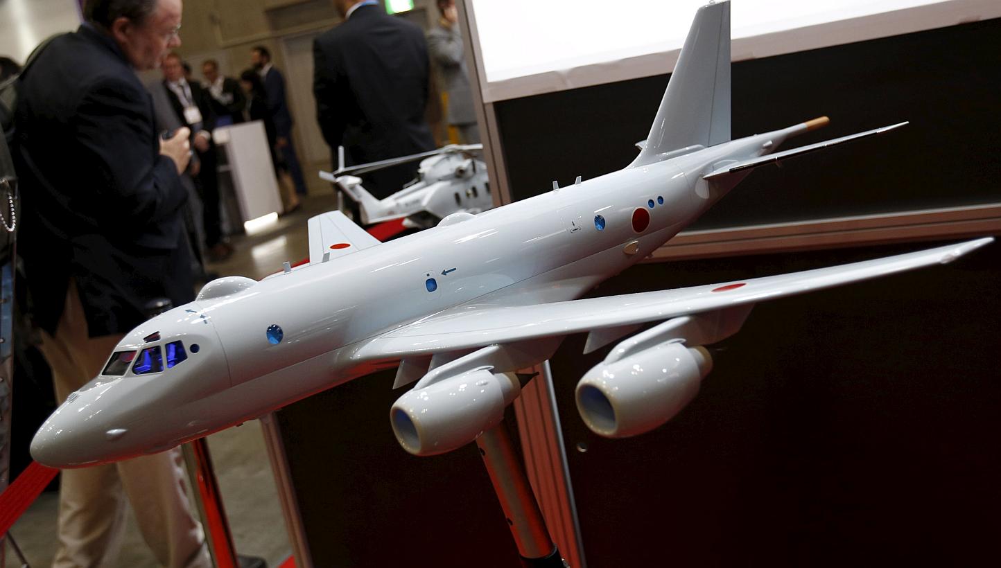 A model of a Japan Maritime Self-Defence Forces P-1 submarine-hunting aircraft is displayed at a defence exhibition in Yokohama on May 13, 2015. Japan's cabinet is set to approve Bills to implement a drastic shift in security policy allowing the mili