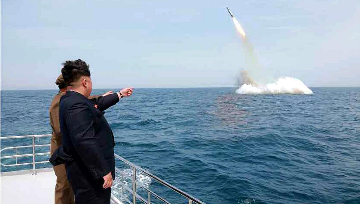 An image obtained by Yonhap News Agency shows North Korean leader Kim Jong Un pointing at a submarine-launched ballistic missile near Sinpo, on the north-east coast of North Korea on May 9, 2015. -- PHOTO: EPA