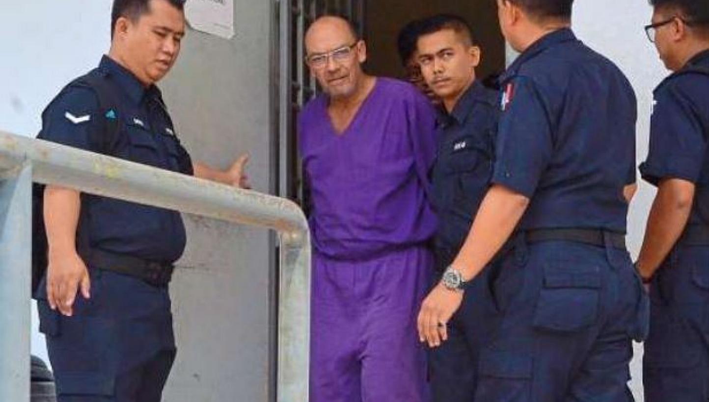 Bali-based German businessman Dietmar Ross (second from left), 54, pleaded guilty to a charge of endangering a cabin crew member by raising his voice, not abiding by the rules of the flight and using harsh words. -- PHOTO: THE STAR/ASIA NEWS NETWORK