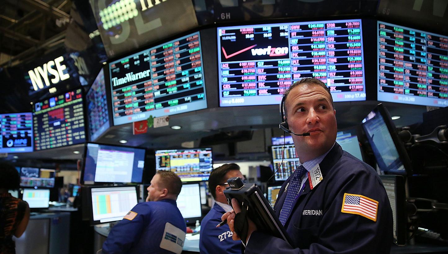 Traders working on the floor of the New York Stock Exchange (NYSE) on May 5, 2015. -- PHOTO: AFP