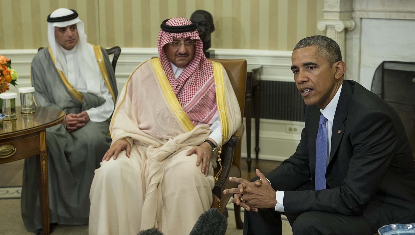 US President Barack Obama speaks to the press with Saudi Crown Prince Mohammed bin Nayef as Foreign Minister Adel al-Jubeir (left) looks on in the Oval Office at the White House in Washington, DC, on May 13, 2015. -- PHOTO: AFP&nbsp;