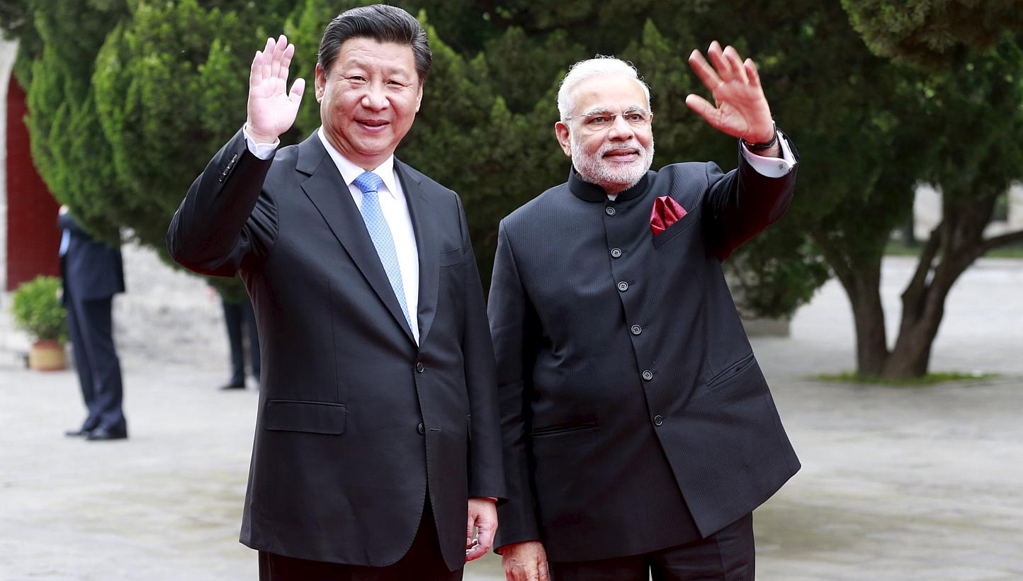 Chinese President Xi Jinping (left) and Indian Prime Minister Narendra Modi during their visit to the Dacien Buddhist Temple in Xi'an, Shaanxi province, on May 14, 2015. -- PHOTO: REUTERS&nbsp;