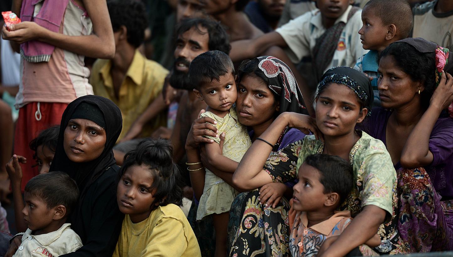 Rohingya migrants on a boat drifting in Thai waters off the southern island of Koh Lipe in the Andaman sea on May 14, 2015. Around 900 Rohingya and Bangladeshi migrants arrived in Indonesia and Thailand on Friday. -- PHOTO: AFP